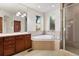 Main bathroom features a soaking tub, double vanity, and shower at 486 S Youngfield Cir, Lakewood, CO 80228