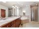 Main bathroom with corner soaking tub and walk-in shower at 486 S Youngfield Cir, Lakewood, CO 80228