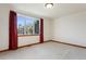 Simple bedroom with neutral carpeting and a large window at 486 S Youngfield Cir, Lakewood, CO 80228