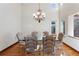 Bright dining room featuring hardwood floors and a chandelier at 486 S Youngfield Cir, Lakewood, CO 80228