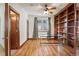 Bright home office features built-in shelves and hardwood floors at 486 S Youngfield Cir, Lakewood, CO 80228