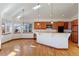 Eat-in kitchen with hardwood floors and an abundance of windows at 486 S Youngfield Cir, Lakewood, CO 80228