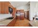 Modern kitchen featuring stainless steel appliances and granite countertops at 486 S Youngfield Cir, Lakewood, CO 80228