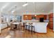 Eat-in kitchen with granite counters, hardwood floors, and ample cabinet space at 486 S Youngfield Cir, Lakewood, CO 80228