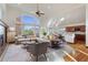 Spacious living room with hardwood floors and a cozy fireplace at 486 S Youngfield Cir, Lakewood, CO 80228