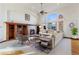 Bright living room featuring hardwood floors and a fireplace at 486 S Youngfield Cir, Lakewood, CO 80228