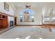 Spacious living room featuring a fireplace and large windows at 486 S Youngfield Cir, Lakewood, CO 80228