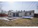 Spacious backyard featuring a flat, grassy lawn and wooden deck, perfect for outdoor relaxation at 1760 S Yuma St, Denver, CO 80223