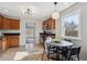 Open kitchen featuring stainless steel appliances and dining area with table and chairs at 1760 S Yuma St, Denver, CO 80223