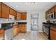 Kitchen featuring stainless steel appliances, dark countertops and tile floors at 1760 S Yuma St, Denver, CO 80223