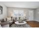 Bright living room featuring neutral decor, stylish furniture, and hardwood floors at 1760 S Yuma St, Denver, CO 80223