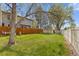 Expansive backyard featuring lush green lawn and secure fencing, offering privacy and space at 8674 Carr Loop, Arvada, CO 80005