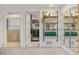 Finished basement showcasing half-bathroom, laundry room, and shelving decor at 8674 Carr Loop, Arvada, CO 80005