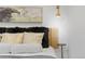 Bedroom close up showcasing stylish headboard with decor pillows and modern lighting at 8674 Carr Loop, Arvada, CO 80005