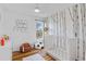 Bedroom featuring an accent wall, modern light fixture, and playful decor at 8674 Carr Loop, Arvada, CO 80005
