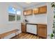 Charming butler's pantry area with cabinets, counter space, coffee maker, and natural light from the window at 8674 Carr Loop, Arvada, CO 80005
