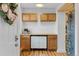 Charming butler's pantry area with cabinets, counter space, coffee maker, and stylish decor at 8674 Carr Loop, Arvada, CO 80005