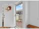 Inviting front entrance with wreath, stylish door and view of the charming outdoor seating area at 8674 Carr Loop, Arvada, CO 80005