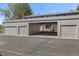 Attached three-car garage and carport providing ample parking and covered entry at 8674 Carr Loop, Arvada, CO 80005