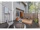 Charming outdoor patio with a fire pit, seating, and wooden deck perfect for relaxing and entertaining at 8674 Carr Loop, Arvada, CO 80005