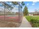 Community tennis court surrounded by fencing and greenery, offering recreational opportunities at 8674 Carr Loop, Arvada, CO 80005