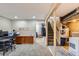 Finished basement area with carpet, storage, and staircase at 1325 Elder St, Denver, CO 80221