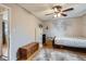 Bedroom featuring hardwood floors, a ceiling fan, and ample space at 1325 Elder St, Denver, CO 80221