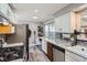 Efficient kitchen with updated counter tops, stainless steel appliances at 1325 Elder St, Denver, CO 80221