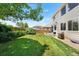 Backyard with a green lawn and a patio area, perfect for outdoor enjoyment at 11853 Trail View Ln, Parker, CO 80134