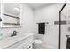 Bathroom featuring a shower, sink, toilet, and dark finishes at 11853 Trail View Ln, Parker, CO 80134