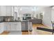 Modern kitchen with stainless steel appliances, granite countertops, and an open layout to the spacious living area at 11853 Trail View Ln, Parker, CO 80134