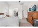 Spacious main bedroom with neutral colors, carpet flooring, and an ensuite bathroom at 11853 Trail View Ln, Parker, CO 80134