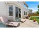 Inviting patio with seating, grill, and sliding door access to the home; perfect for outdoor relaxation and entertainment at 11853 Trail View Ln, Parker, CO 80134
