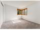 Neutral bedroom with carpet and a large window providing natural light at 11932 W 56Th Cir, Arvada, CO 80002