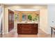 View of kitchen island with granite countertops and ample storage, perfect for food preparation at 11932 W 56Th Cir, Arvada, CO 80002