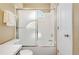 Bathroom featuring shower with sliding doors and a tiled base at 11932 W 56Th Cir, Arvada, CO 80002