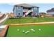 Backyard showcasing a bocce ball court and landscaped surroundings of this beautiful two-story home at 15640 Spruce St, Thornton, CO 80602