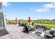 Outdoor patio area featuring a fire pit, lounge seating, and backyard view at 15640 Spruce St, Thornton, CO 80602