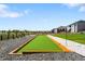 Beautifully designed backyard with a bocce ball court and landscaped surroundings in a Gathering-friendly neighborhood at 15640 Spruce St, Thornton, CO 80602