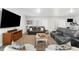 Spacious finished basement featuring a large television, comfortable seating, and recessed lighting for a cozy ambiance at 15640 Spruce St, Thornton, CO 80602