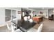 Spacious finished basement with a billiards table, living area, and access to the outdoor hot tub at 15640 Spruce St, Thornton, CO 80602