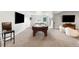 Finished basement featuring a billiards table, flat screen television, comfortable seating, and neutral decor at 15640 Spruce St, Thornton, CO 80602