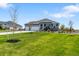 Charming home featuring a well-manicured lawn and an inviting front porch at 15640 Spruce St, Thornton, CO 80602