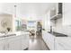 Bright kitchen with stainless steel appliances and seamless layout into the dining area at 15640 Spruce St, Thornton, CO 80602