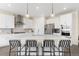 Modern kitchen with stainless steel appliances, pendant lighting, and a large center island at 15640 Spruce St, Thornton, CO 80602