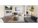 Cozy living room featuring a modern fireplace and comfortable seating at 15640 Spruce St, Thornton, CO 80602