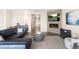 Elegant living room with a fireplace, TV, and comfortable seating at 15640 Spruce St, Thornton, CO 80602