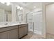 Modern bathroom with double vanity and large shower at 27480 E Cedar Pl, Aurora, CO 80018