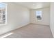 Bright bedroom with neutral carpeting and window at 27480 E Cedar Pl, Aurora, CO 80018