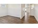 Bright hallway with wood-look flooring leading to other rooms at 27480 E Cedar Pl, Aurora, CO 80018